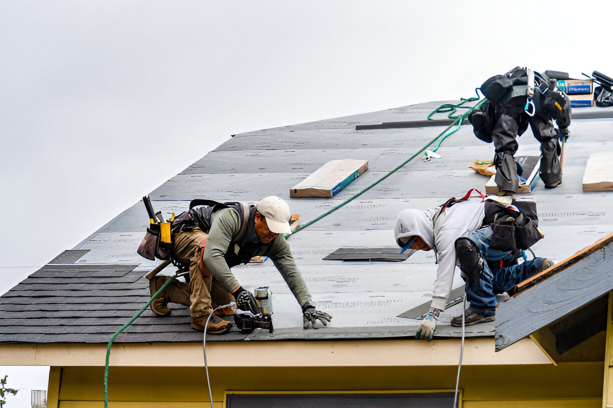 FRS roof installer working on roof